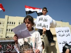 أطفال المعتقلين يطالبون بالحرية لآبائهم