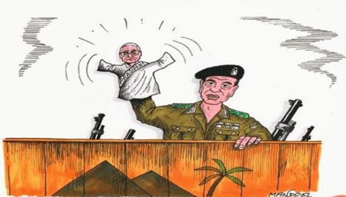 فنان ألماني يرسم "الطرطور" دمية في يد قائد الانقلاب