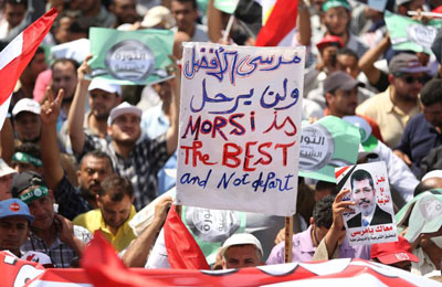 "أقباط المهجر" فرحين بالانقلاب العسكري على الرئيس مرسي