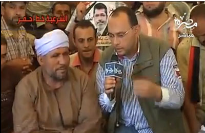 بالفيديو.. صعيدي مسيحي يشارك في اعتصام "رابعة" دعمًا للرئيس مرسي