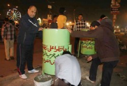 "الحرية والعدالة" يضع صناديق للقمامة بشوارع أرض اللواء