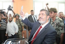 "النيويورك تايمز" تقارن بين تصويت "مرسي" و"شفيق"