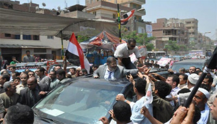 تجار سوق الجمال يتعهدون بجمع 750 ألف صوت لمرسي