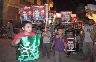 حملات مكثفة لطرق الأبواب ومسيرة أطفال دعمًا لمرسي بالفيوم