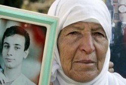 حماس تطالب بحل قضية الأسرى ومفاوضات سرية بين عباس وأولمرت