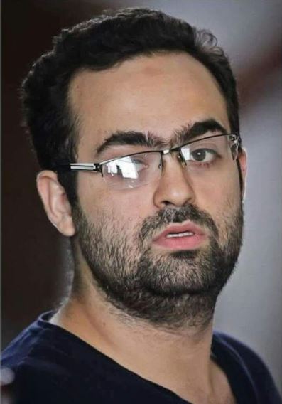 زوجة الناشط محمد عادل تطالب بالإفراج عنه